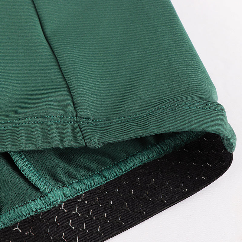 Men's green long sleeve thermal jersey. Elastic grippers at the waist hem.