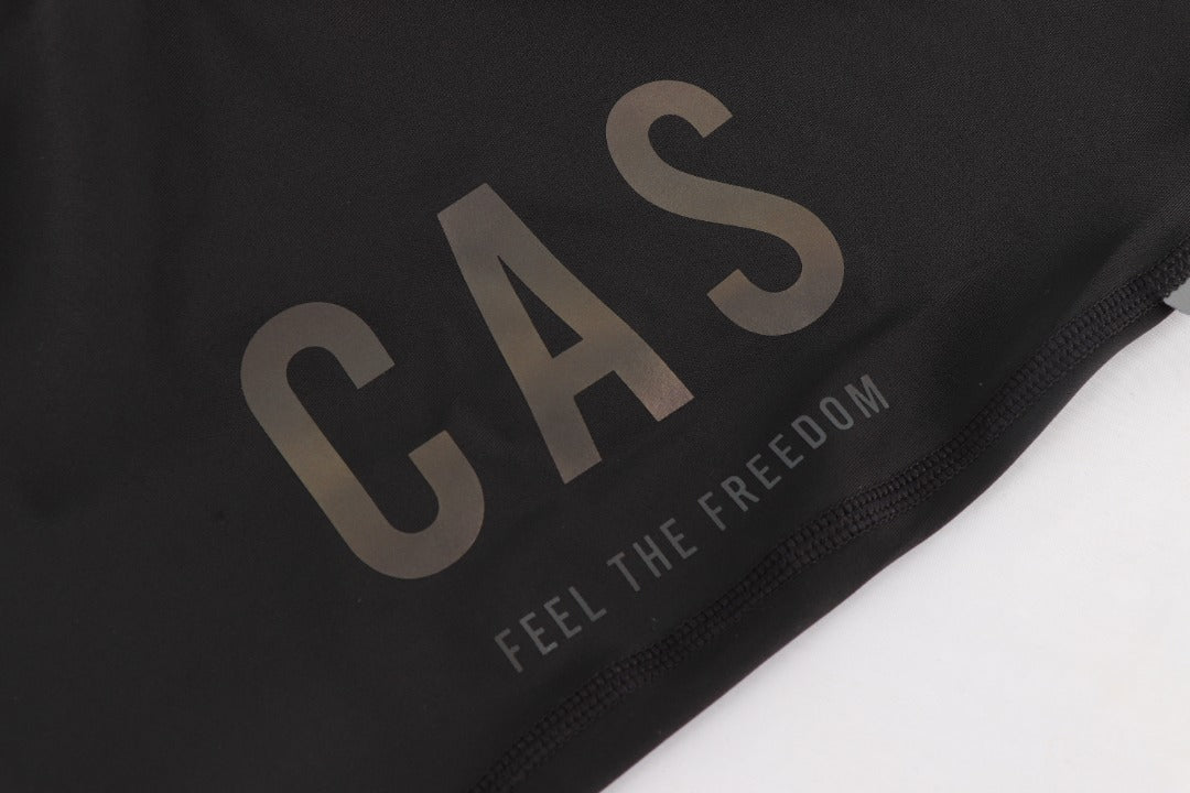 Men's black magnetic snap buckle bib shorts. CAS Feel the freedom grey to colourful reflective logo.