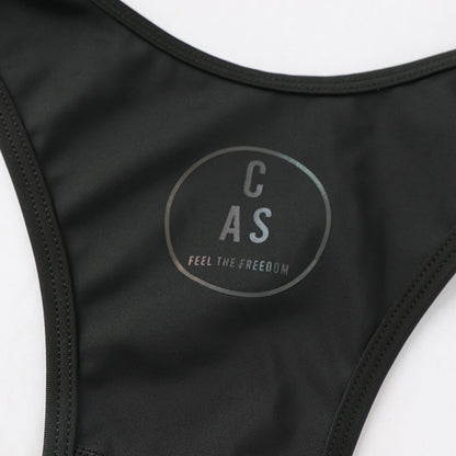 Rear CAS Feel the Freedom circular logo on black bib leggings.