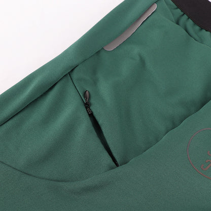 Green long sleeve thermal jersey. Back zipper pocket. Rear reflective strip.